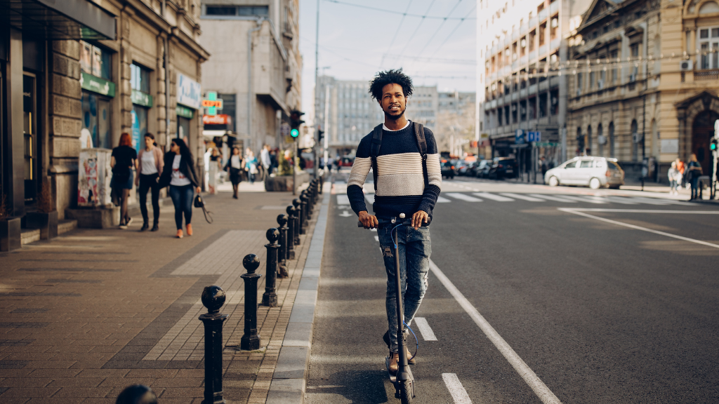 A man riding a scooter